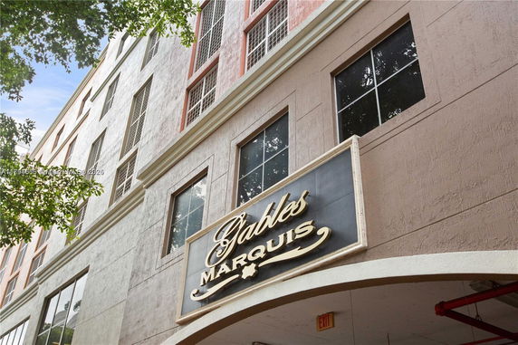 Front view of a multi-story building with a sign displaying 'Gables Marquis'.