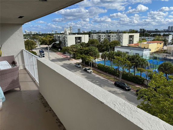 View of surrounding residential and recreational areas from the building.