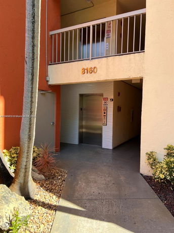Front view of a building entrance with an elevator.