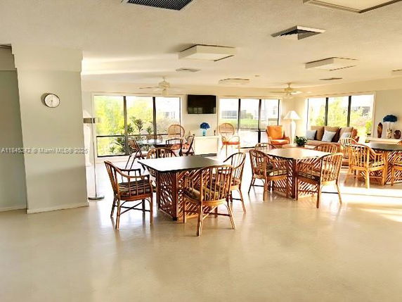 Common area with tables and chairs for recreation activities