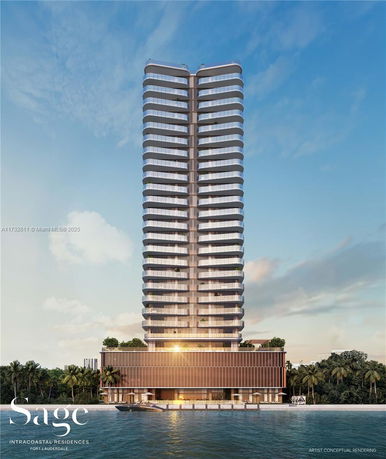 Front view of a modern high-rise residential building next to a body of water.
