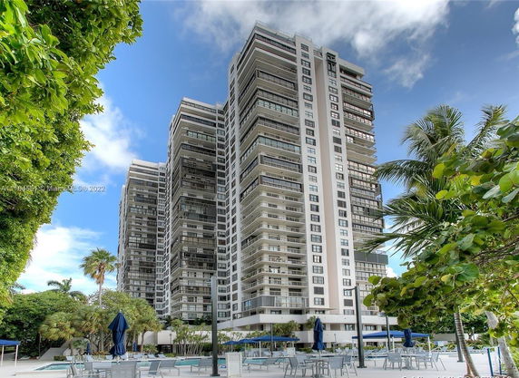 Front view of a modern high-rise building with balconies.