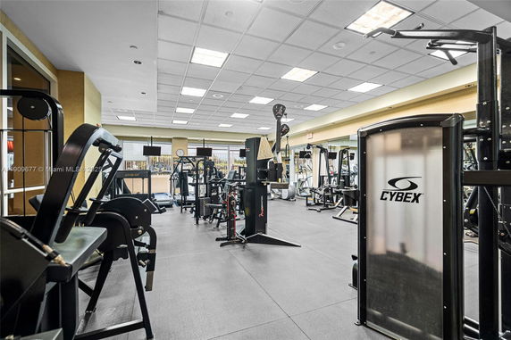 Indoor gym area with various exercise equipment.