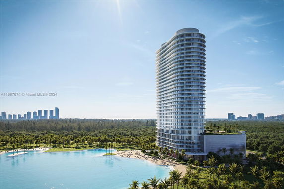 Front view of a tall, modern residential building with a curved design.