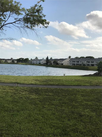View of water body and distant residential buildings.
