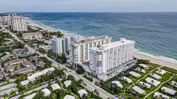 Aerial view of a coastal area with high-rise buildings near the beach.