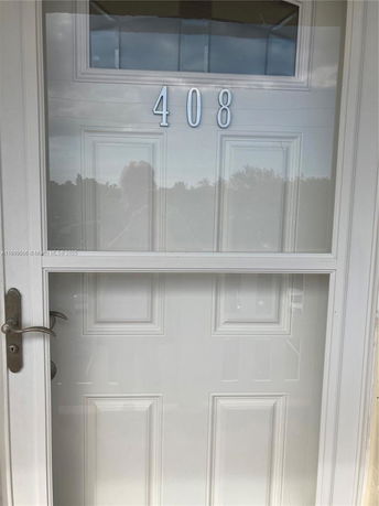 Front view of a door with house number 408.