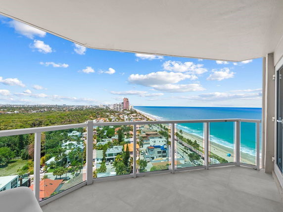 Panoramic view of the coastline and cityscape from a building.