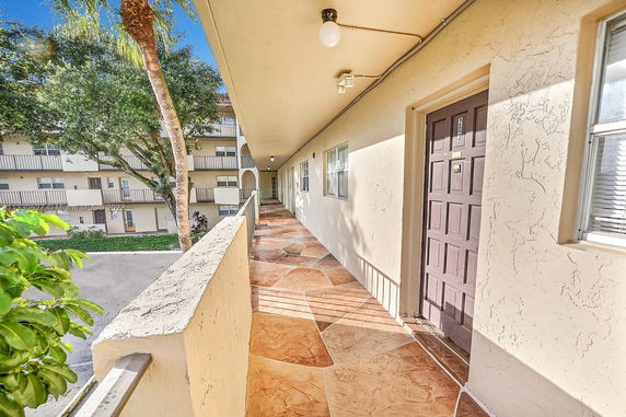 View from an outdoor walkway in an apartment complex.