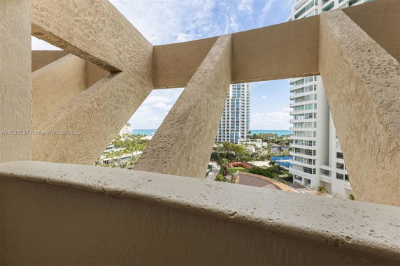 View of city buildings and partial ocean from a high vantage point.