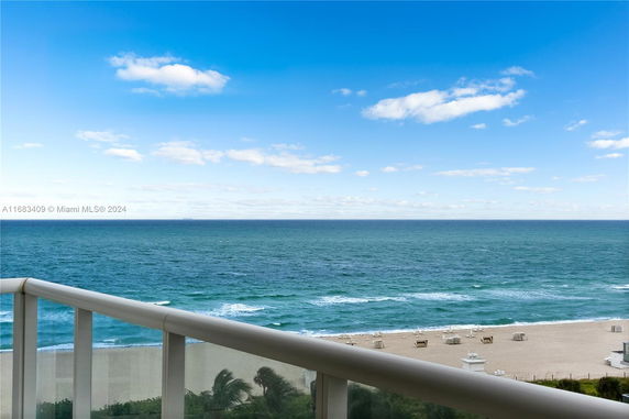 Panoramic ocean view from a balcony.