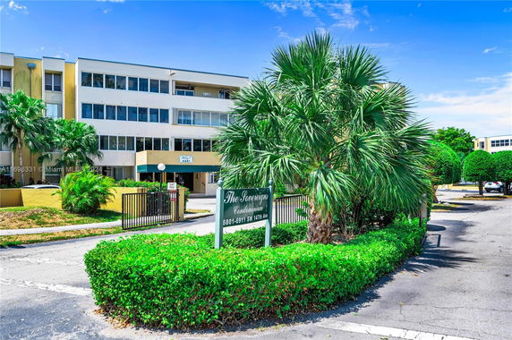 Front view of a multi-story condominium building.
