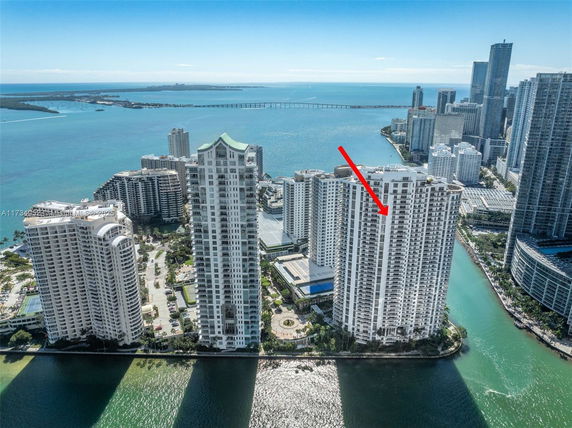 Panoramic view of high-rise buildings near a waterfront.