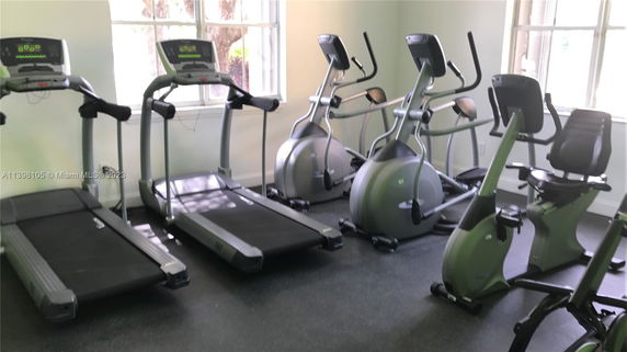 Indoor gym area with treadmills and exercise bikes.