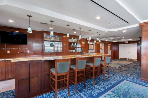 Interior view of a clubhouse with a bar and seating area.