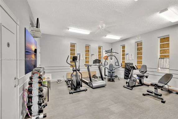 Indoor gym area with various exercise equipment.