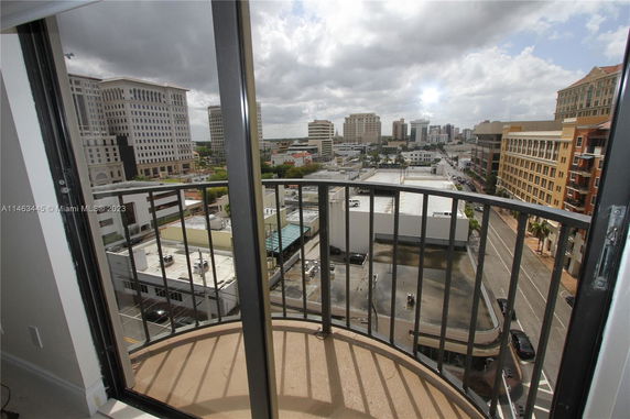 View of surrounding buildings from a high-rise balcony.