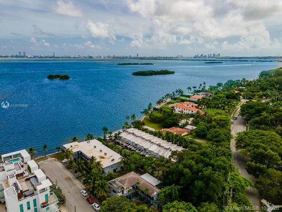 Panoramic view of a coastal area with buildings and water in the background.