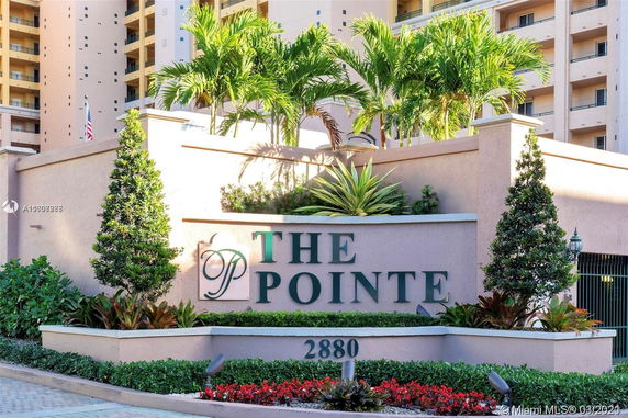 Front view of a multi-story building with signage that says 'The Pointe'.