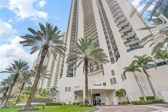 Front view of a high-rise residential building with balconies.