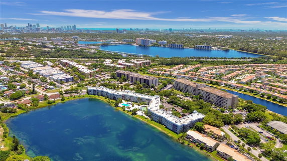 Panoramic view of buildings and bodies of water in an urban landscape.