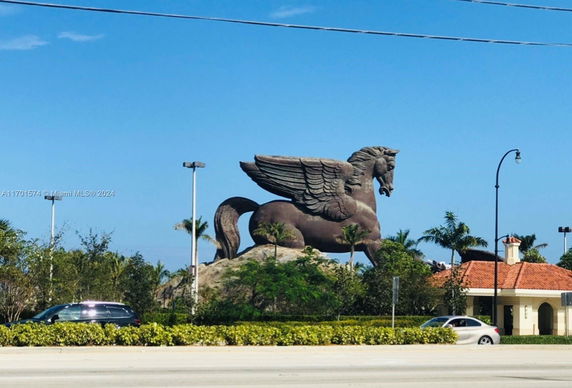 Large Pegasus statue in an outdoor setting.
