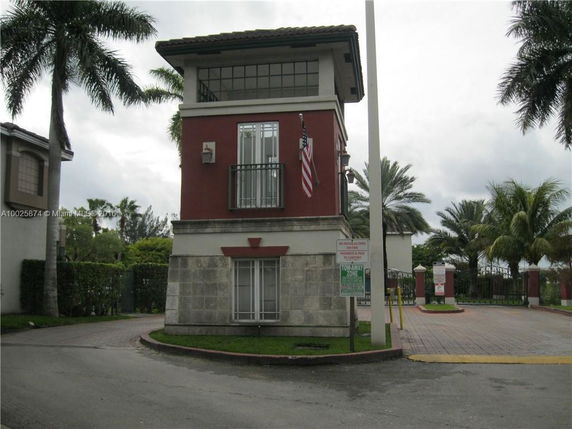 Front view of a small guardhouse with stone and red exterior.