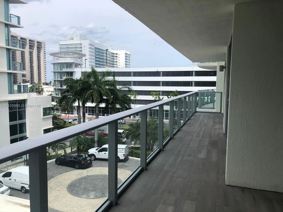 View from a high balcony showing surrounding buildings.