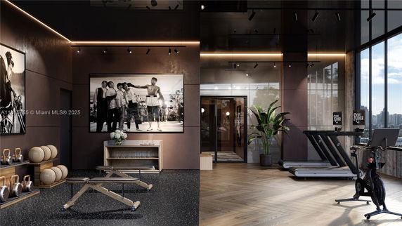 Modern indoor recreation area with exercise equipment and large windows.