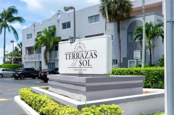 Front view of a multi-story condominium building.