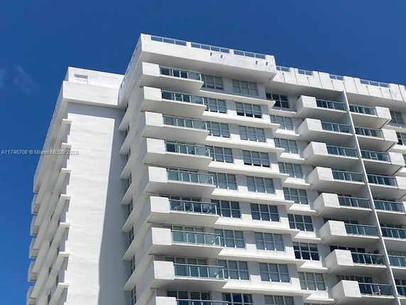 Front view of a multi-story apartment building.