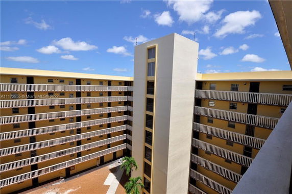 Elevated view of a multi-story building with balconies.