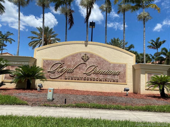 Front view of the entrance signage for Royal Poinciana Luxury Condominiums.