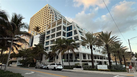 Front view of a multi-story building with a modern architectural design.
