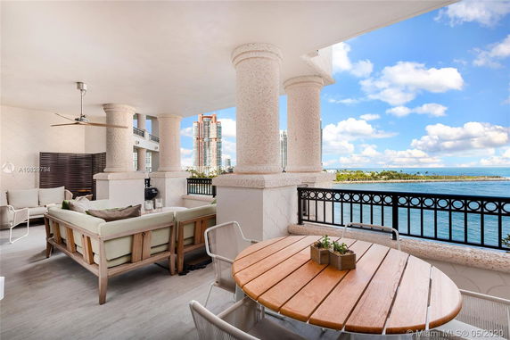 Outdoor terrace with seating area and ocean view.