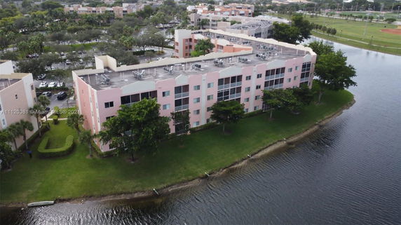 Aerial view of a multi-story building near a body of water.