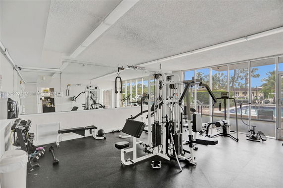 Interior view of a gym with various exercise equipment.
