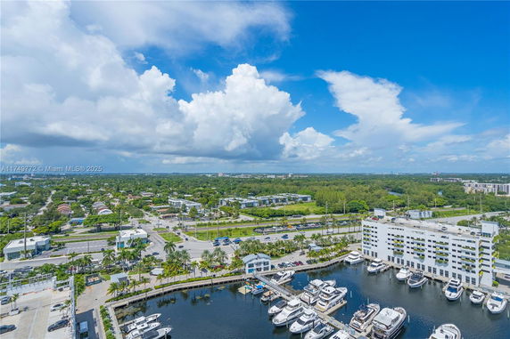Wide angle view of a marina with boats and surrounding area.