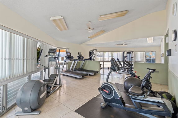 Indoor gym area with exercise machines and equipment.