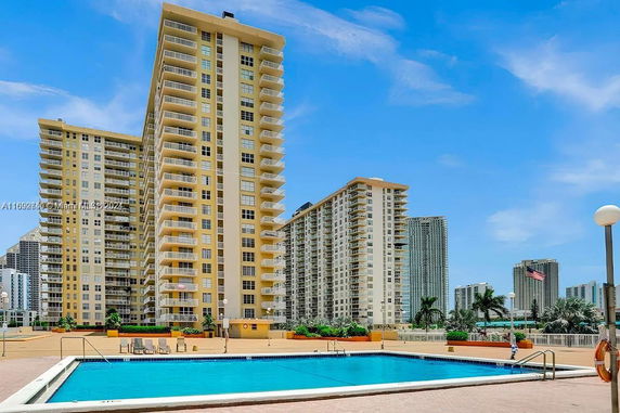Front view of multiple high-rise residential buildings with balconies.