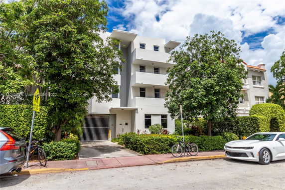 Front view of a modern multi-story apartment building.