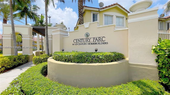 Front view of Century Parc residential building with signage.