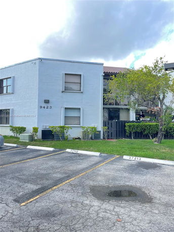 Front view of a two-story building with a simple design.