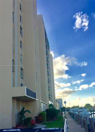 Side view of a multi-story building with balconies.