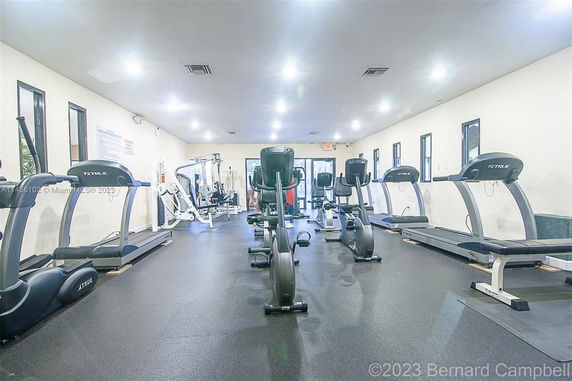 Indoor gym with treadmills and exercise equipment.