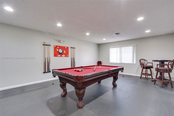Indoor area with a billiards table and seating