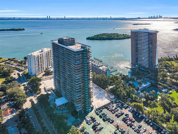 Aerial view of several high-rise buildings near a body of water.