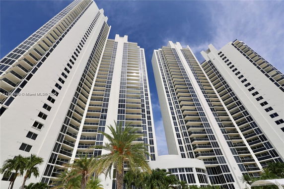Front view of high-rise residential buildings with balconies.
