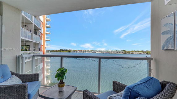 View of surrounding areas with water body seen from a balcony.