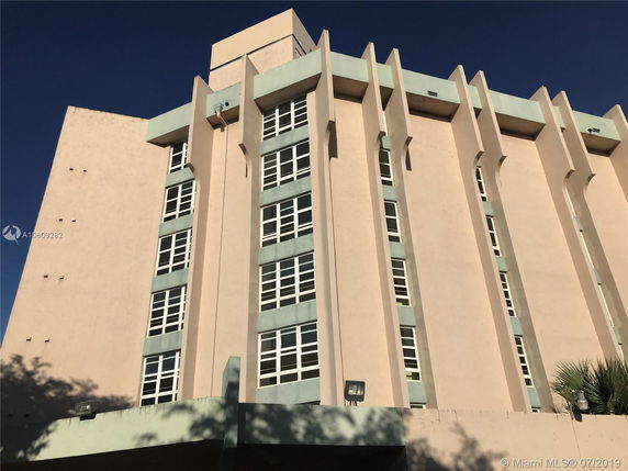 Front view of a multi-story building with unique architectural design.
